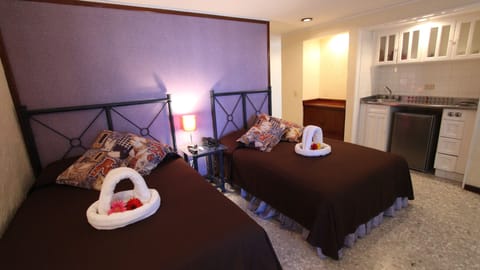 Family Quadruple Room | 1 bedroom, minibar, individually decorated, iron/ironing board