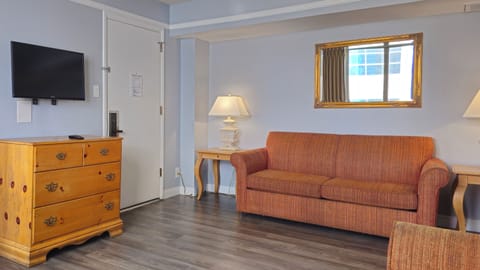 One-Bedroom Corner Suite | Living area | TV