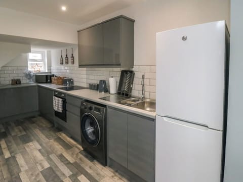 Fridge, electric kettle, cookware/dishes/utensils