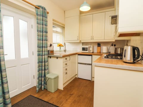 Fridge, electric kettle, toaster, cookware/dishes/utensils