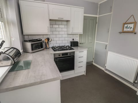 Fridge, electric kettle, toaster, cookware/dishes/utensils