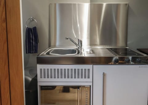 Fridge, electric kettle, toaster, cookware/dishes/utensils