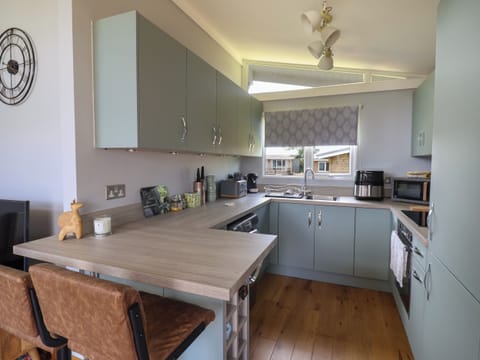 Fridge, electric kettle, toaster, cookware/dishes/utensils