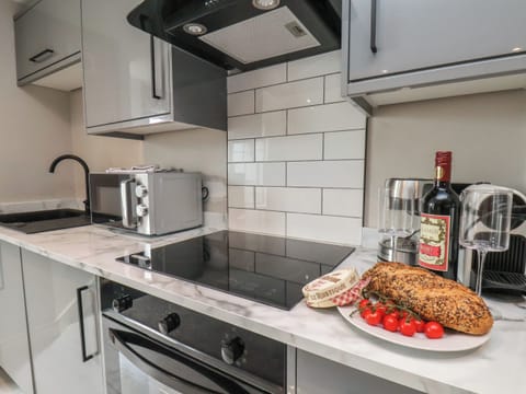 Fridge, electric kettle, toaster, cookware/dishes/utensils