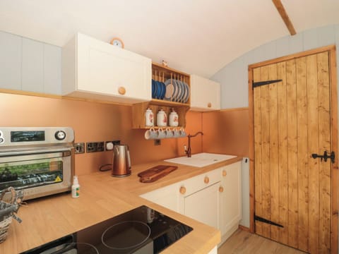 Fridge, electric kettle, cookware/dishes/utensils