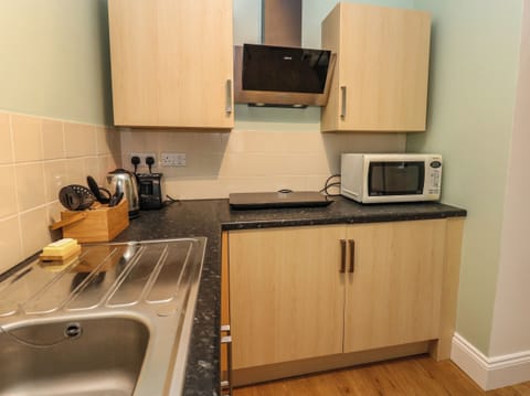 Fridge, electric kettle, toaster, cookware/dishes/utensils