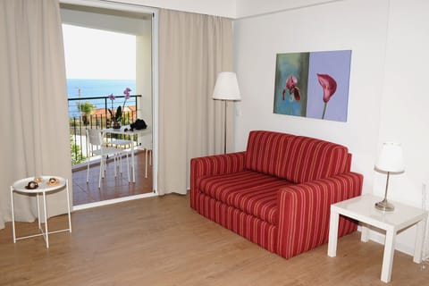 Family Apartment, 1 Bedroom, Partial Ocean View | Living area | Flat-screen TV