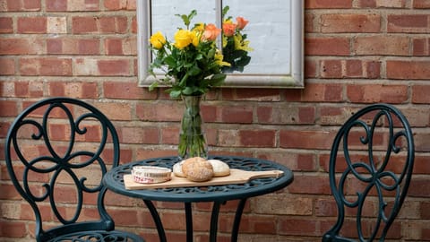 The pretty alfrresco dining area is perfect for a glass of wine