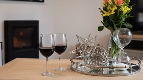 Relax in front of the fire with a glass of wine