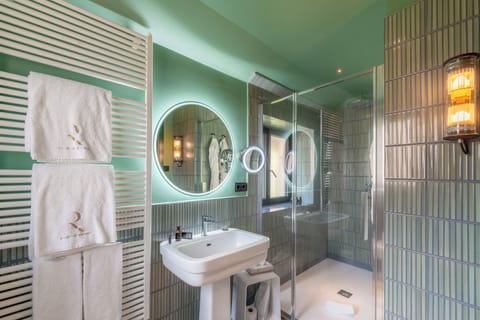 Shower, hair dryer, slippers, towels