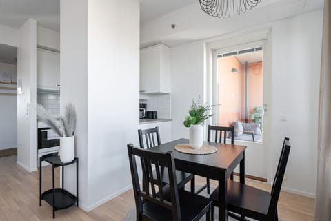 While dining, you have a view of the kitchen and the city of Tampere. If you wish, you can also dine on the cosy balcony.