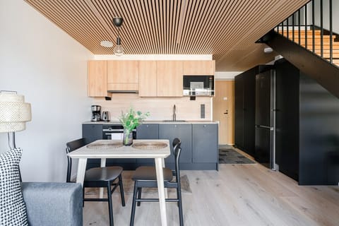 Apartment kitchen with a dishwasher, oven, stovetop and a microwave