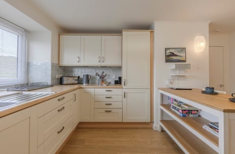 Spacious kitchen with stove, oven, m'wave, range, fridge/freezer and dishwasher.