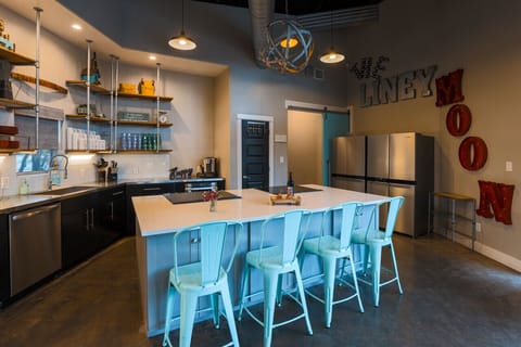 Recently updated kitchen has two refrigerators, two ovens, and two cooktops!