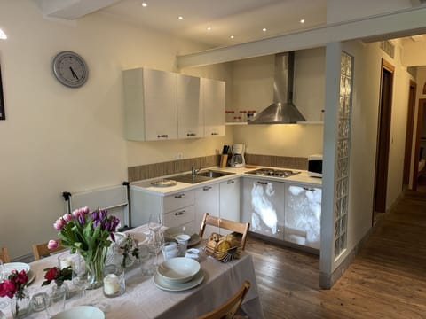 Furniture, Interior Design, Flooring, Floor, Wood, Kitchen, Countertop, Ceiling, Room, Kitchen Appliance