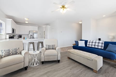 When you first enter our home, you'll be greeted by our cozy living, dining, and kitchen area. The living room has seating, a gas fireplace, and a large Smart TV.