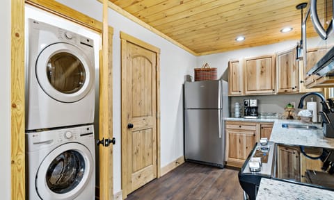 Full sized washer and dryer located in the kitchen