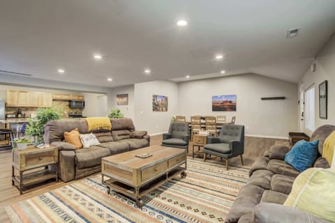 Unwind in the spacious living room, featuring a cozy fireplace, plush seating, and a Smart TV. Perfect for movie nights, conversation, or simply enjoying the mountain retreat ambiance.