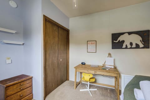 A cozy workspace and storage – this bedroom features a dedicated desk for reading or remote work, along with a spacious closet to keep belongings organized during your stay.
