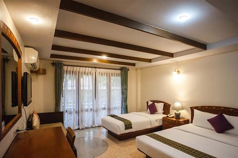Deluxe Room, Pool View | In-room safe, individually decorated, desk, laptop workspace