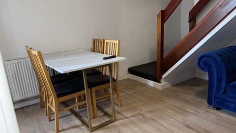 Enjoy meals in the dining area equipped with a table and chairs. Ideal for sharing meals, planning your day, or enjoying a cup of coffee.