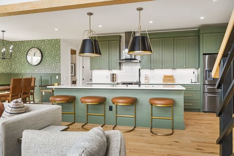 Gather in our stylish open-concept kitchen and dining area, perfect for entertaining and group meals. Enjoy high-end appliances, ample seating, and a seamless flow designed for comfort and connection.