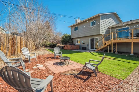 Beautiful backyard oasis with a fire pit seating area, lush green space, and a spacious deck—perfect for outdoor gatherings and relaxation.




