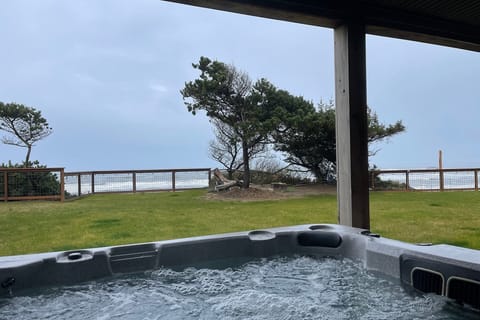 Relax in the hot tub while watching the moods of the sea.