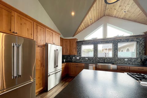 Two refrigerators in the gourmet kitchen.