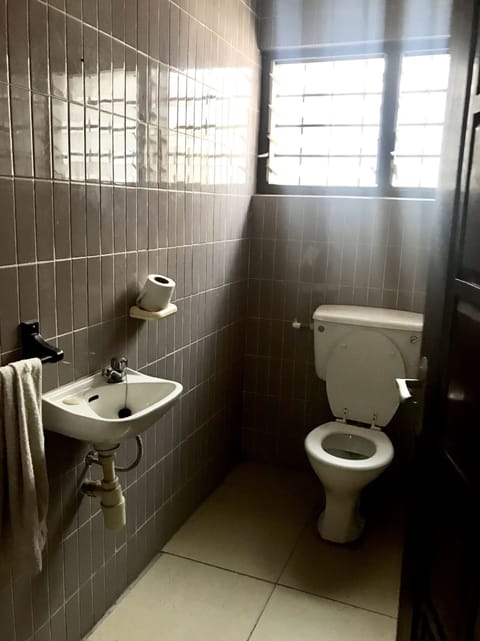 Basic Triple Room, Shared Bathroom | Bathroom | Shower, hair dryer, towels, shampoo