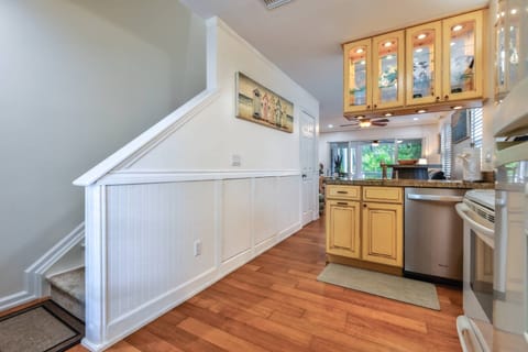 The kitchen is bathed in plenty of natural light, creating a bright and airy space for cooking and gathering.