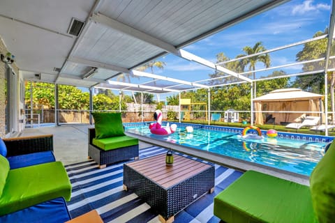 Patio by the pool with cozy seating