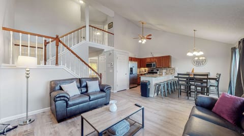 A warm and inviting living room, complete with a cozy fireplace and stunning outdoor views! 🔥🛋️✨