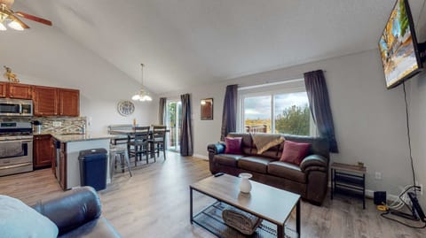 A warm and inviting living room, complete with a cozy fireplace and stunning outdoor views! 🔥🛋️✨