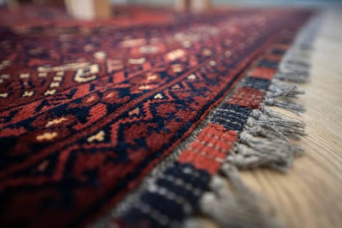 An authentic Persian hand-woven wool rug is soft and warm underfoot.