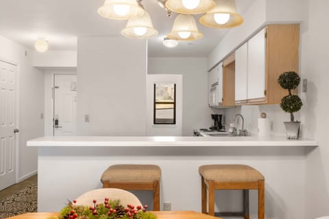 Grab a bite at the kitchen counter or gather for meals at the dining table for 4