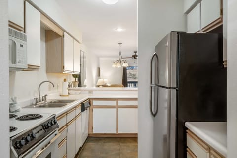 Ample counter space & homey amenities await in the open kitchen
