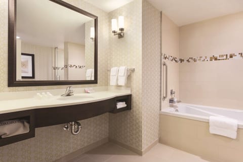 Suite, 1 King Bed | Bathroom | Free toiletries, hair dryer, towels, soap
