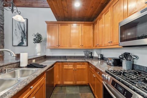 Kitchen: Main floor, drip coffee maker, Keurig, toaster, cooking utensils, tableware