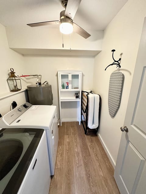 Laundry room, all soaps included with iron, steamer, and roll away cot.