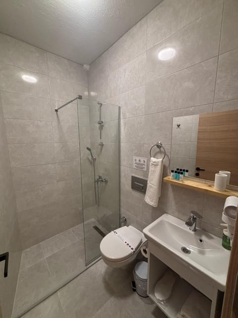 Deluxe Double Room, City View | Bathroom | Shower, free toiletries, hair dryer, slippers