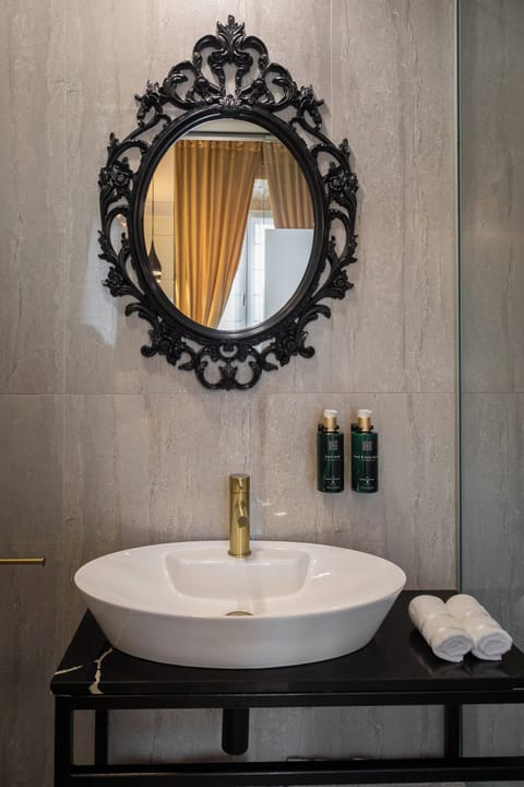 Luxury Room 2 | Bathroom | Shower, hair dryer, slippers, towels