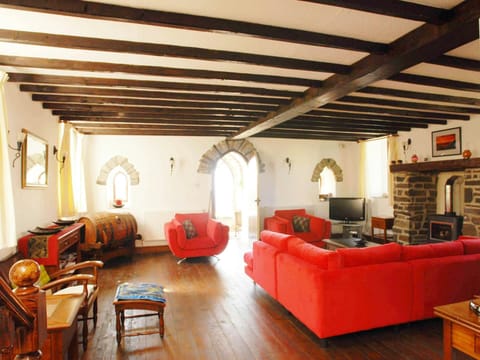 Living room wit large sofa and two armchairs