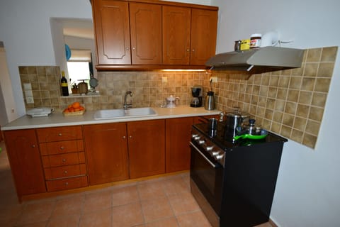 Deluxe Apartment, 1 Bedroom | Private kitchen | Full-size fridge, stovetop, coffee/tea maker, electric kettle