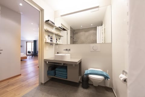 Family Quadruple Room | Bathroom | Eco-friendly toiletries, hair dryer, towels, soap