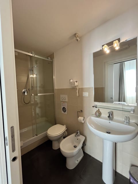 Triple Room | Bathroom | Shower, hair dryer, towels, soap