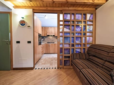 Furniture, Wood, Interior Design, Flooring, Kitchen, Cabinetry, Floor, Room, Major Appliance, Cupboard