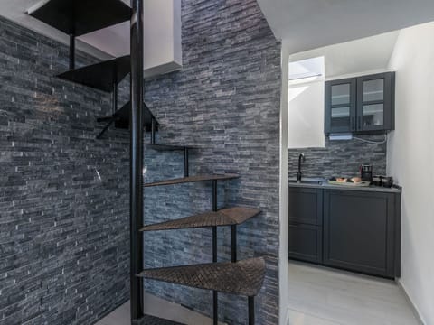 Furniture, Wood, Interior Design, Flooring, Kitchen, Cabinetry, Floor, Room, Major Appliance, Cupboard