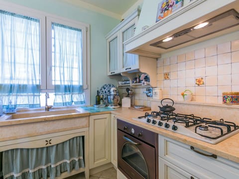 Furniture, Wood, Interior Design, Flooring, Kitchen, Cabinetry, Floor, Room, Major Appliance, Cupboard