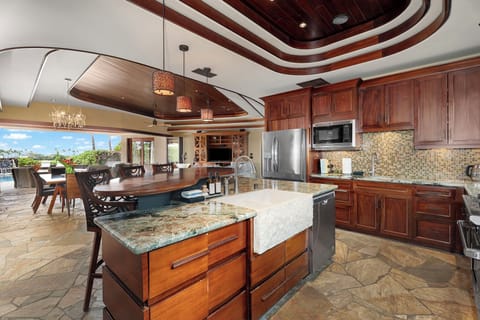A chef’s dream kitchen featuring rich wood finishes and high-end countertops.